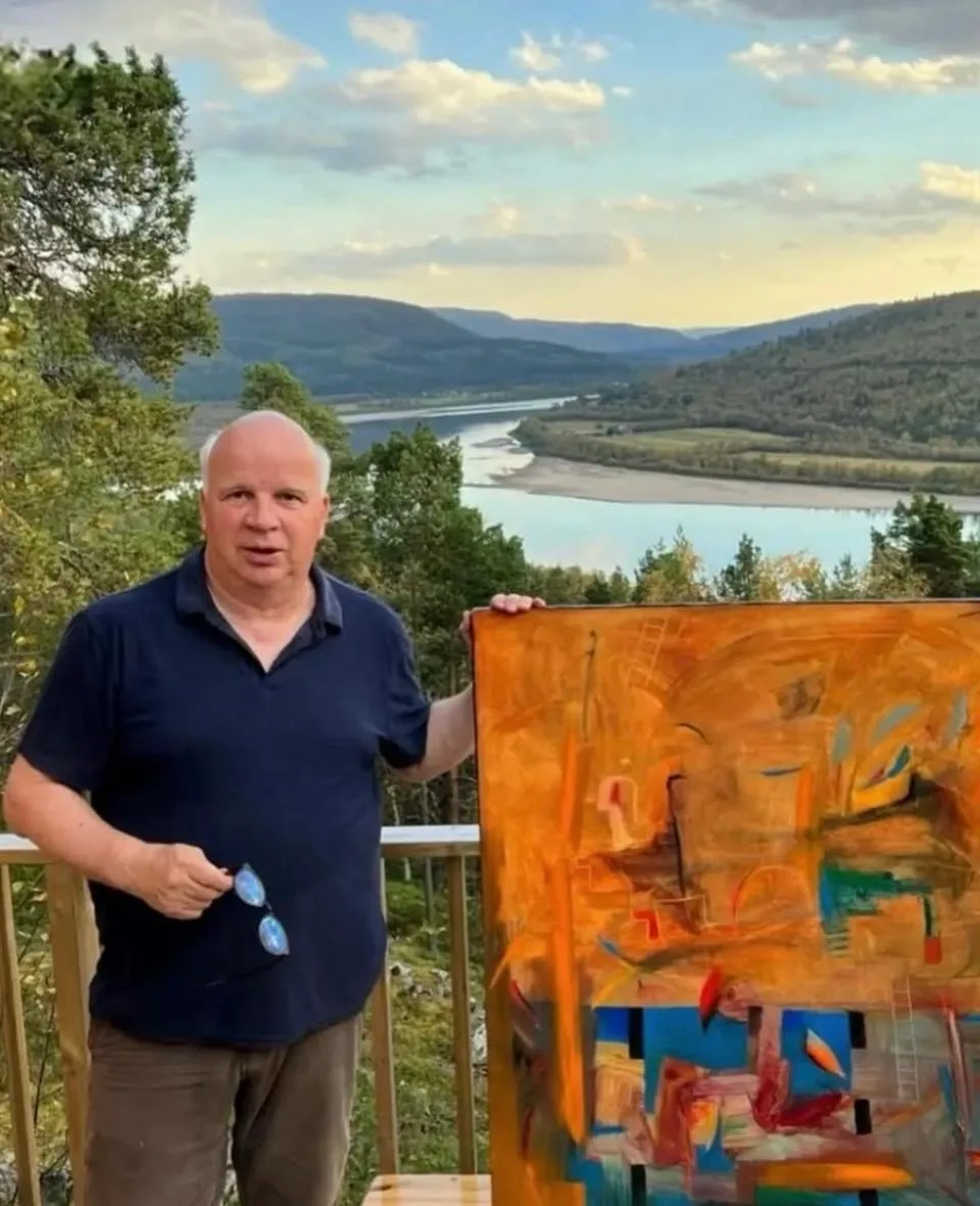 Matti Sirvio with a painting above the river valley in Lapland, Finland